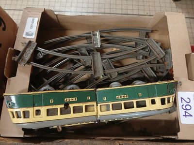 a box full of model train tracks and a train car