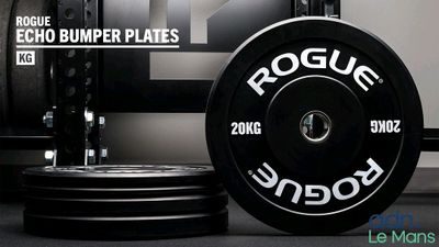 a black and white picture of a barbell plate and a black and white picture of a barbell plate