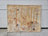 un tableau posé par terre près d'un bâtiment