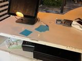 a desk with a monitor and a keyboard on top of it