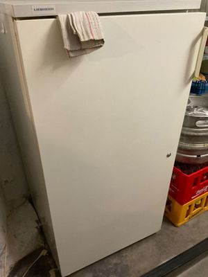 a white refrigerator that is sitting in a room