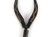 the necklace is made of horn horns and black beads