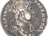 une pièce de monnaie en argent portant un visage de femme