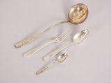 four spoons and two spoons on a white table