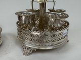 a silver plate with cups and saucers on it