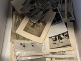 a box full of old photos of people in the past