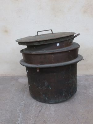 three pots that are stacked on top of each other