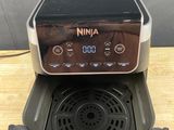 a small air fryer sitting on top of a wooden table