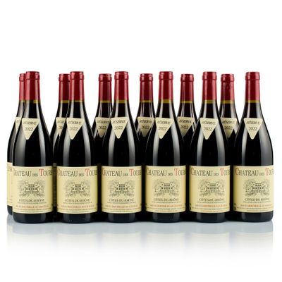 six bottles of wine lined up in a row on a white surface
