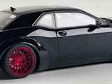 black dodge charger with red rims on a white background