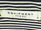 a close up of a person holding a bag with a label on it