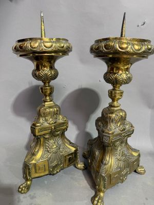 pair of antique brass candlesticks with lion heads