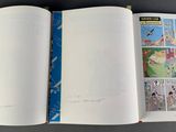 an open book with a picture of a cartoon on it