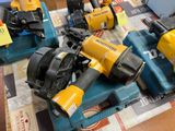 a lot of power tools that are sitting on a table