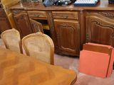 a desk with a telephone and a chair in the room