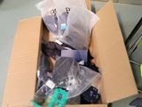 a cardboard box full of electronic equipment on the floor