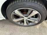 a close up of a tire on a car ' s rim