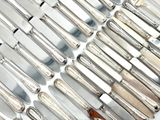 a lot of knives that are on a table