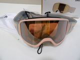 a pair of ski goggles sitting on a table next to a bag