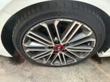 a close up of a car tire with a red circle on it