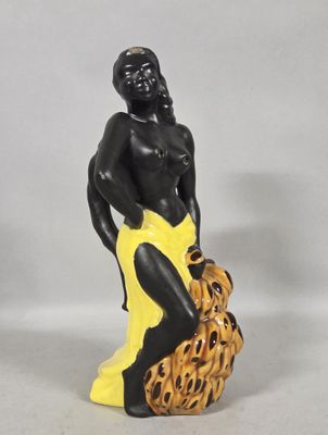 figurine of a woman with a basket of bananas