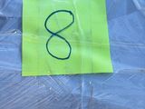 a yellow sticker on the back of a blue umbrella
