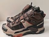 a close up of a pair of hiking shoes on a table