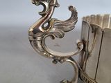 a silver bracelet with a dragon on it