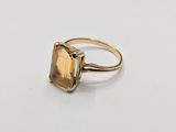 a close up of a ring on a white surface