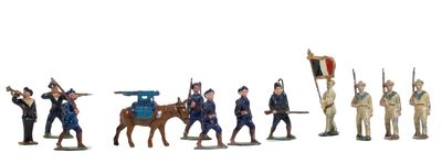 many figurines of men in uniforms on a white background