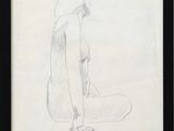 drawing of a woman sitting on the ground in a black frame