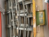 a box with a bunch of metal chairs in it