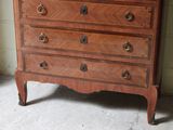 a dresser with a mirror on top of it in a room