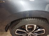 a close up of a car ' s tire on the ground