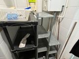 an image of a bathroom with a sink and shelves
