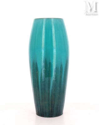 a blue vase that is sitting on a table
