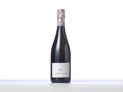 a bottle of wine that is sitting on a table