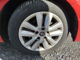 a close up of a tire on a red car