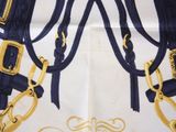 a close up of a blue and gold horse halter