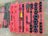 a tool set in a pink case on the ground