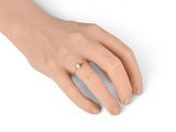 a close up of a person ' s hand with a ring on it