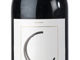 a bottle of wine that is sitting on a table