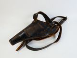 an old leather holster on a white surface with a white background