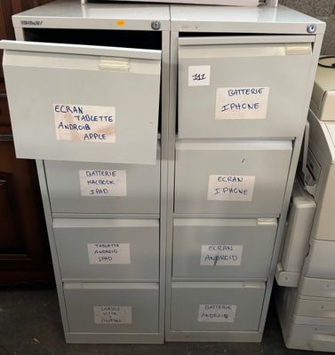 a stack of filing cabinets with labels on them