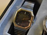 two watches that are sitting in a box together