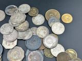 a lot of coins that are on the table