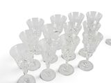 a lot of wine glasses that are sitting on the table