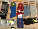 several pairs of men ' s socks sitting on top of a cardboard box