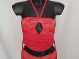 a close up of a mannequin wearing a red dress on a mannequin stand
