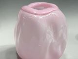 two pink vases sitting next to each other on a table